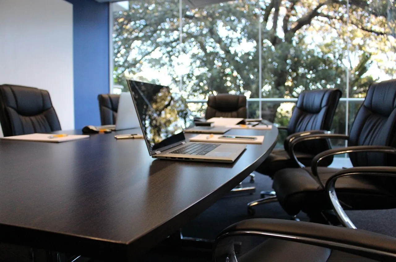 Stock photo: Corporate lawyers reviewing documents in a boardroom