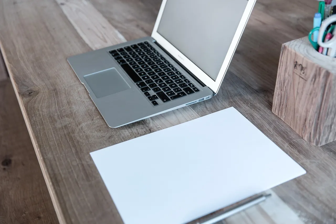 Stock photo: Close up of an open laptop on a wooden desk