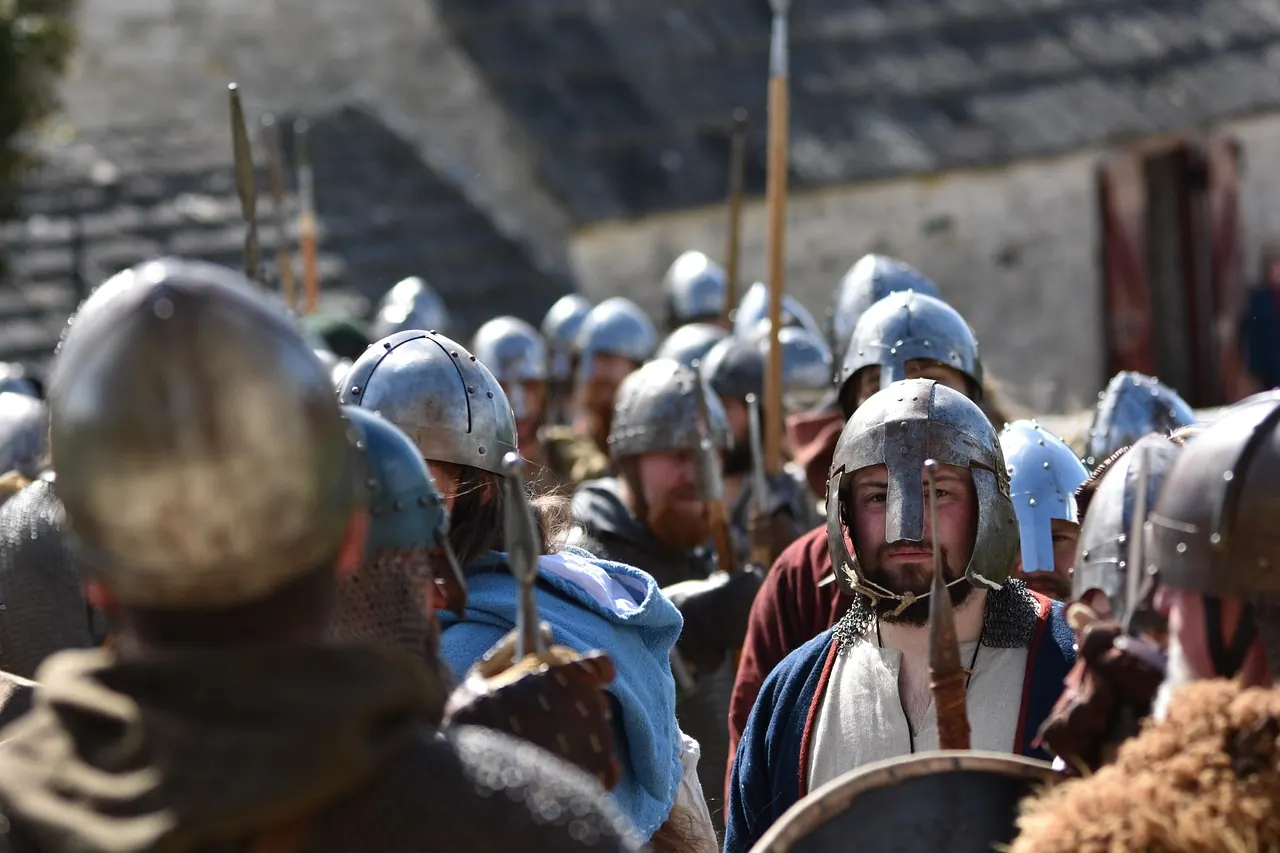 Stock photo: medieval reenactors fighting in a muddy field