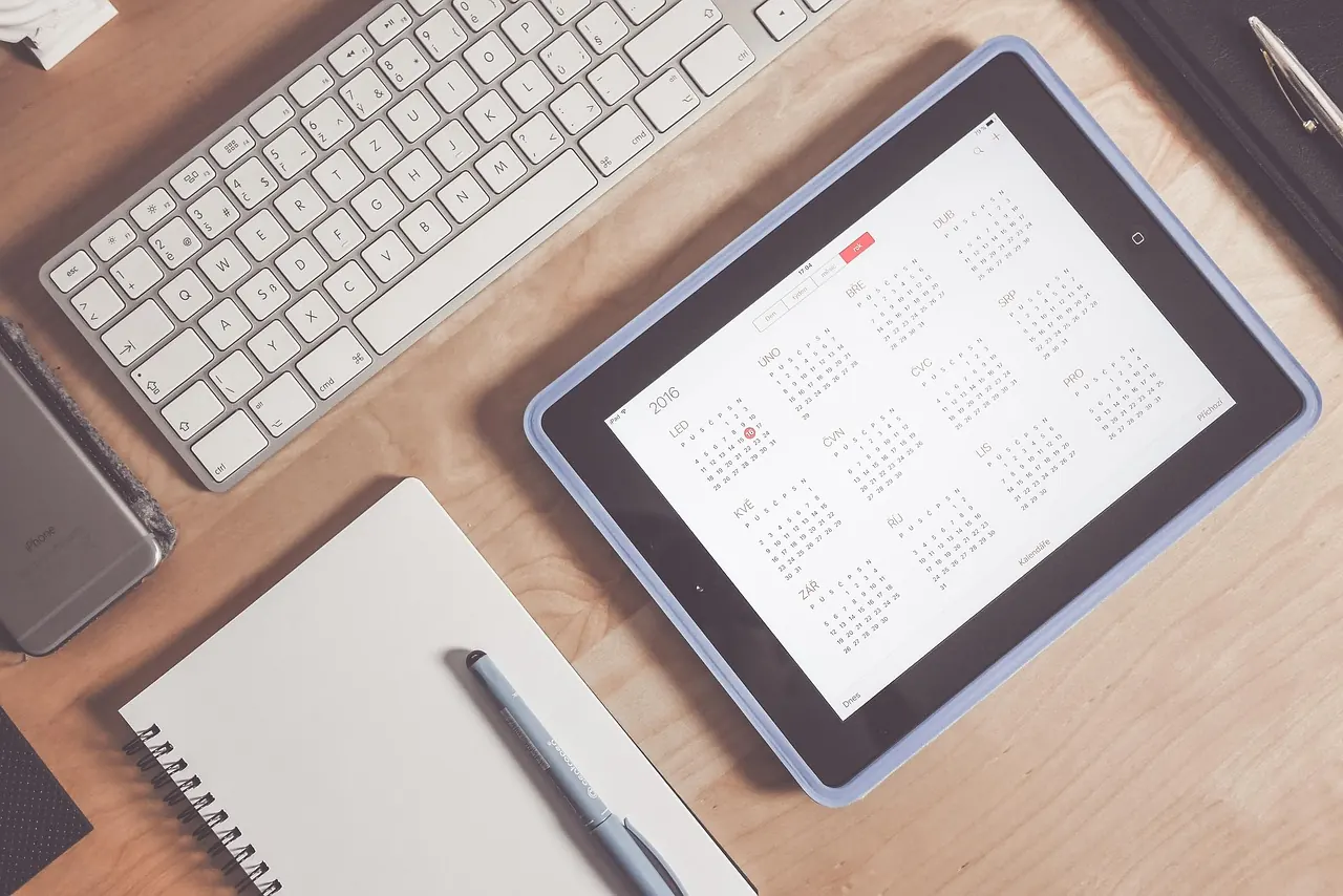 Stock photo: stressed person looking at messy calendar schedule