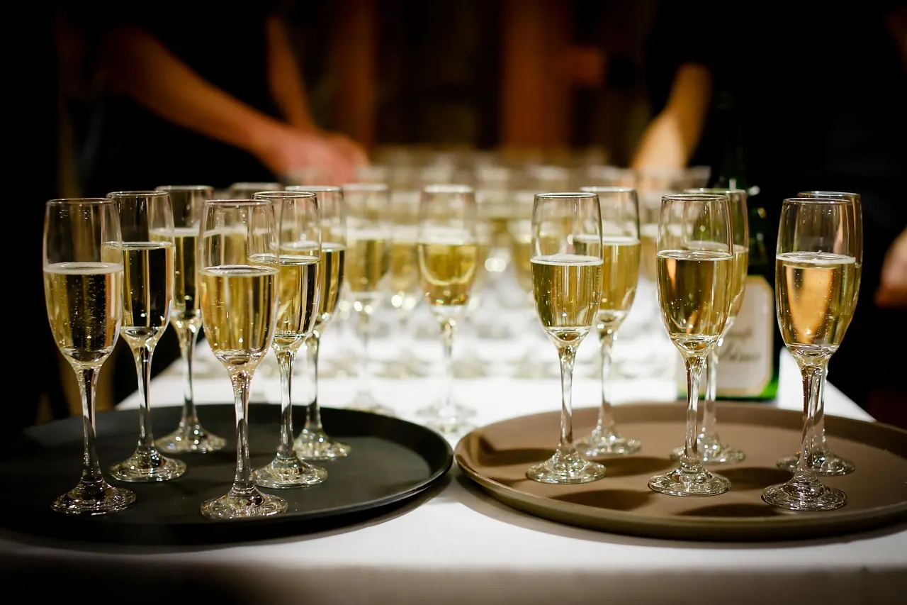 Stock photo: business people celebrating modestly with champagne