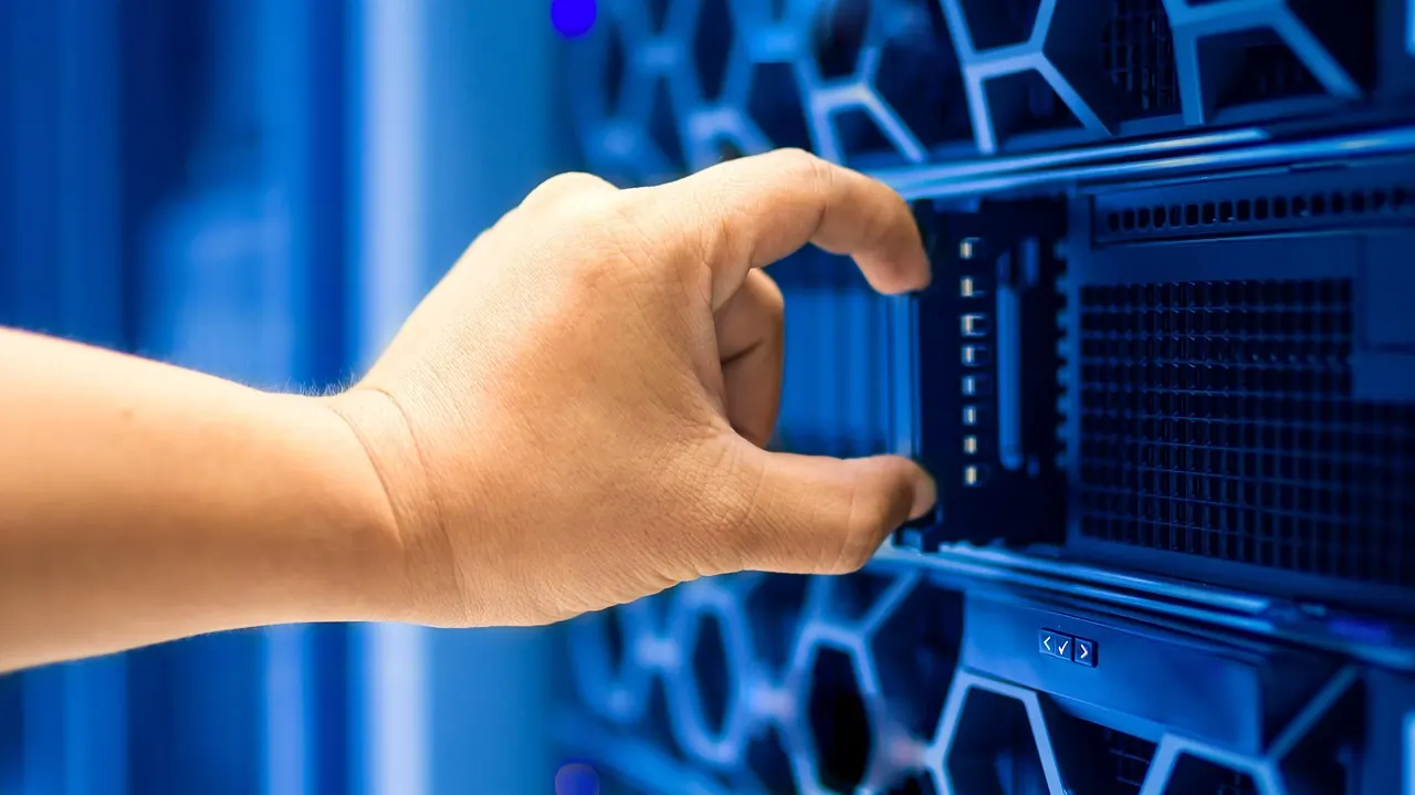 Stock photo: rows of glowing servers in a datacentre
