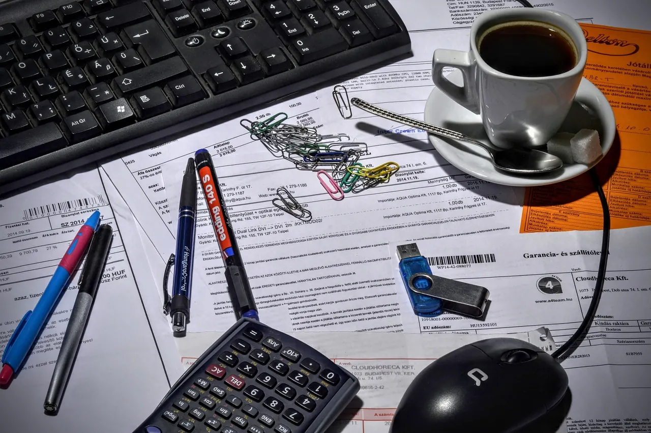 Stock photo: A financial advisor handing a large bill to a stressed client