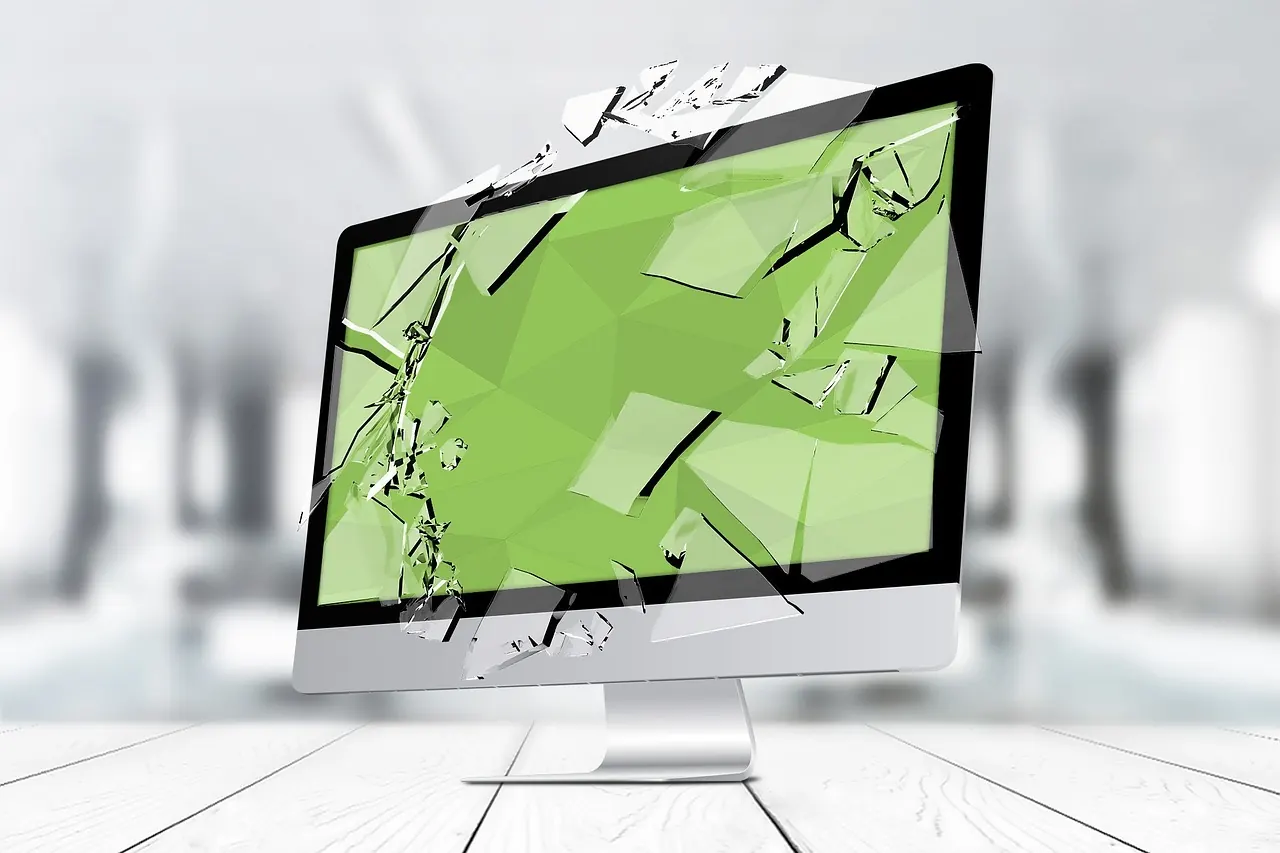 Stock photo: frustrated person sitting in front of broken computer