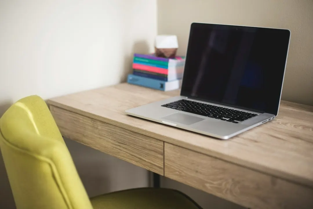 Stock photo: person closing laptop on home desk