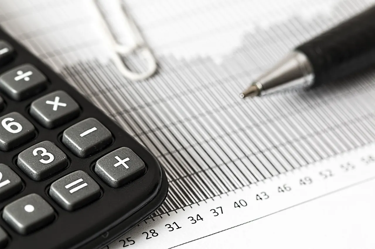 Stock photo: calculator resting on financial paperwork