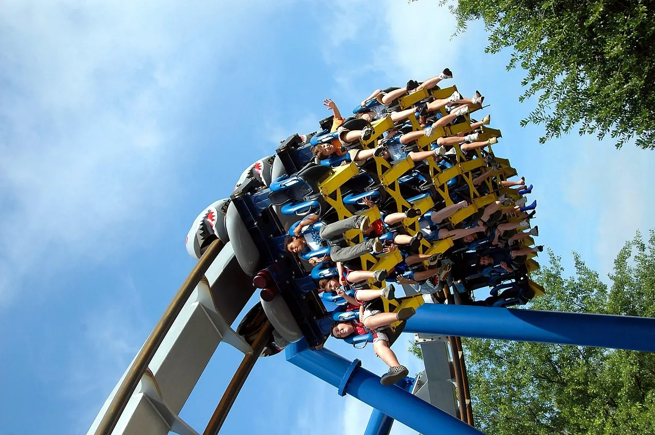 Stock photo: empty rollercoaster track against a cloudy sky
