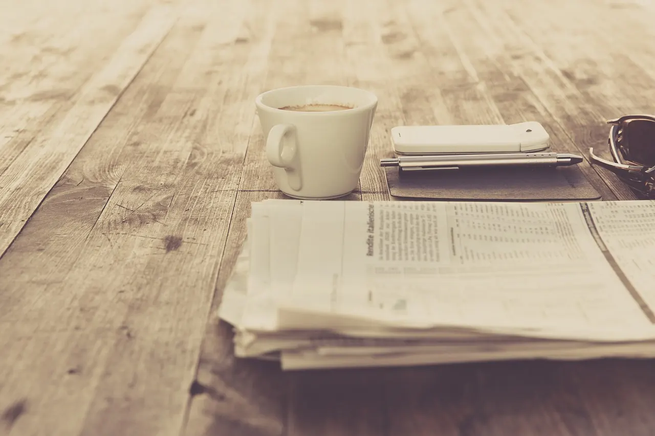 Stock photo: newspaper and coffee