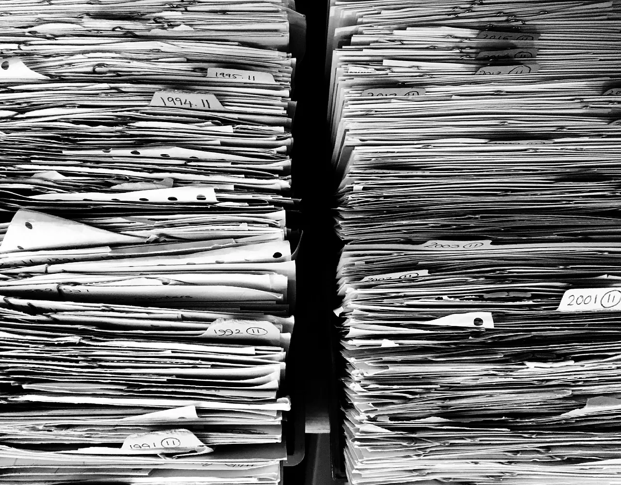 Stock photo: office worker filing forms in folder