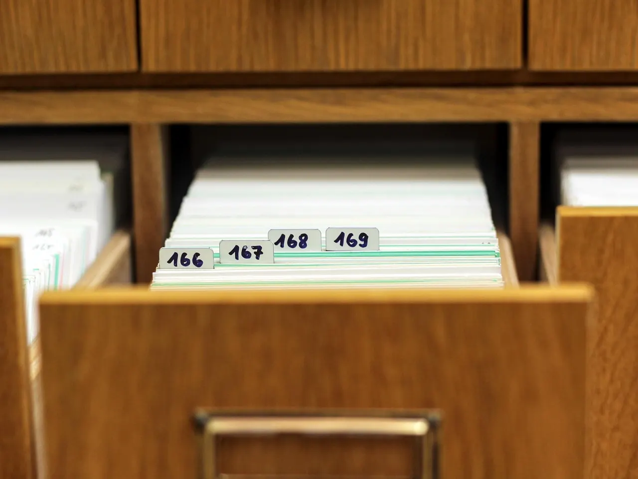 Stock photo: organized rows of office filing cabinets