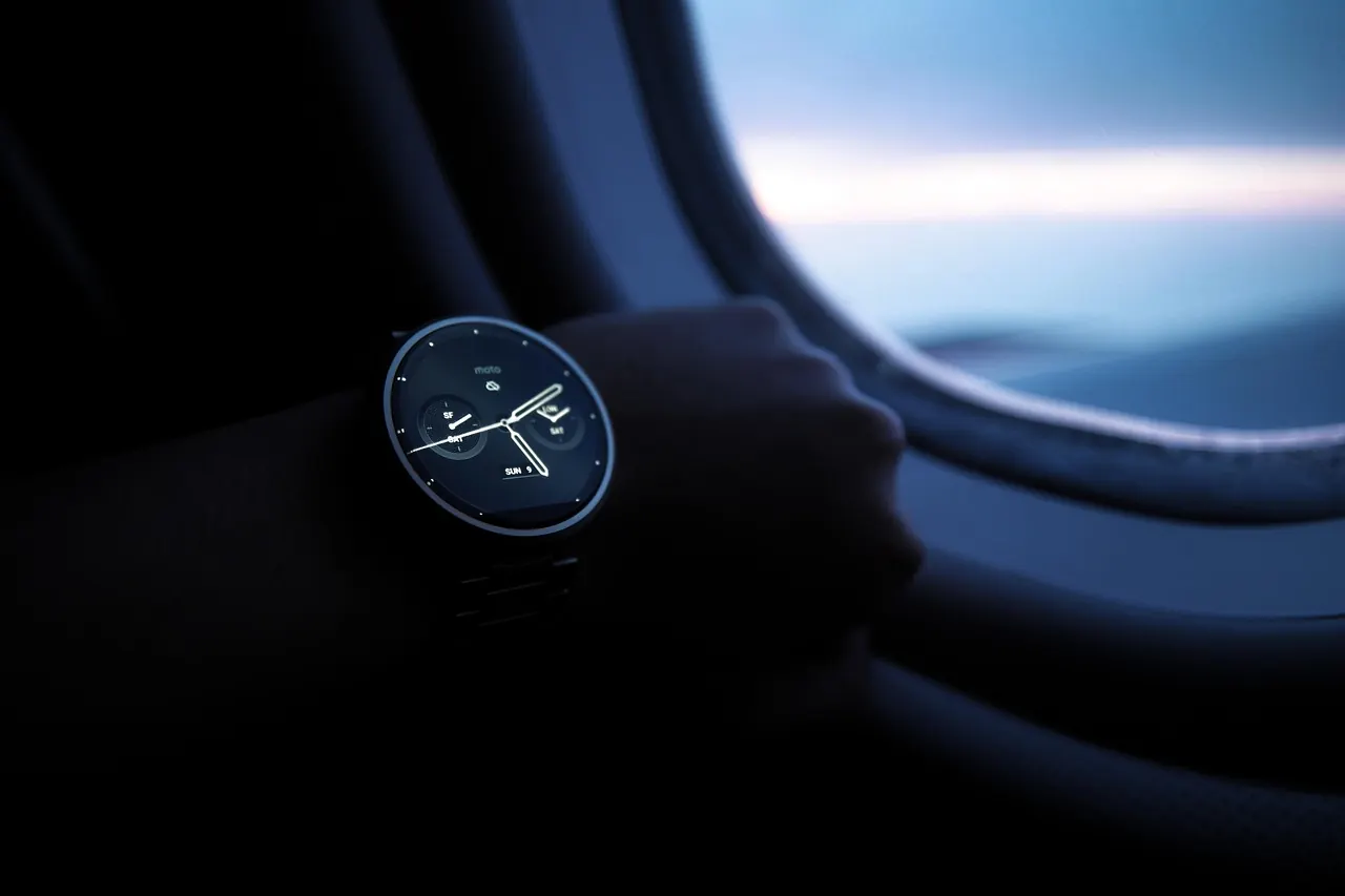 Stock photo: person looking at smartwatch on wrist