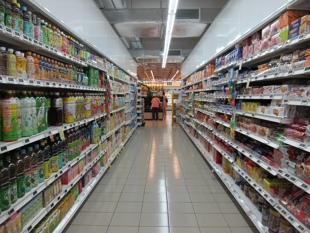 Stock photo: shopper examining cereal boxes in supermarket aisle